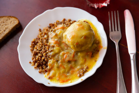 Boiled buckwheat with meatball and sauce