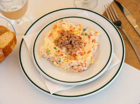 Delicious Russian salad topped with minced canned tunaの写真素材