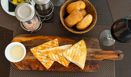 Traditional Mexican Quesadillas with cheese and sauce