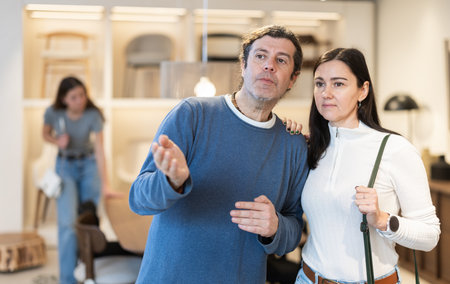 Married couple choosing furniture in a storeの写真素材