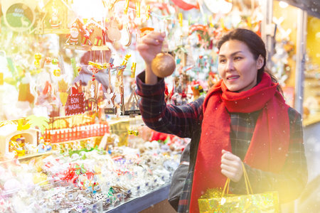 Woman purchasing christmas decorationsの写真素材