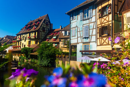 Scenic cityscape of Colmar on banks of canal on summer day, Franceの写真素材