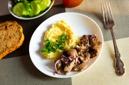 Mushrooms with mashed potatoes on white plateの写真素材
