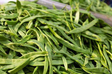 Many of young bean pods at market for sale