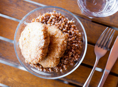Traditional Ukrainian dish - lunch bowl with buckwheat porridge and cutlet. Healthy dinner