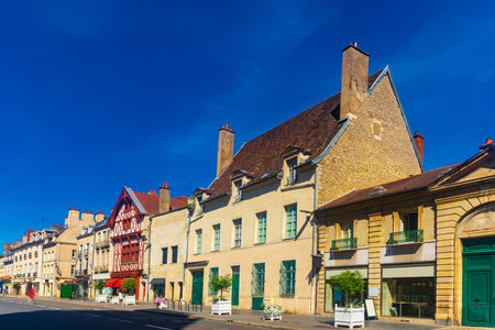Summer cityscape of Dijon with narrow street and typical townhousesの写真素材