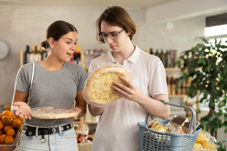 Couple choosing pizzaの写真素材