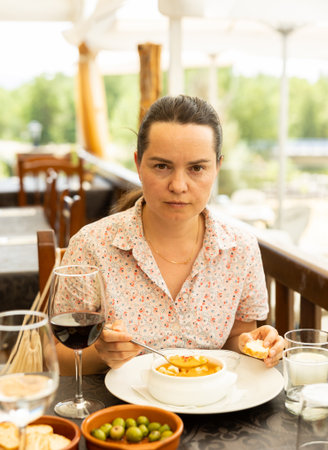 Portrait of woman having lunch gazpacho traditional dish of Spanish cuisineの写真素材
