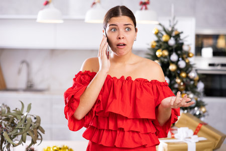 young woman was upset by an unpleasant phone callの写真素材