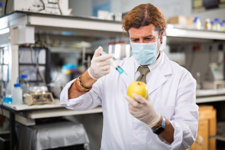 Man technician working in food testing laboratory