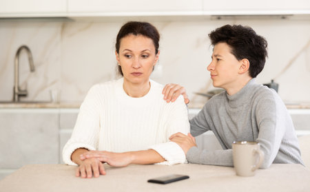 Son trying to apologize to his offended mother after home disagreements