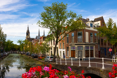 The canals and waterways in the city of Delft in the Netherlands on a sunny dayのeditorial素材