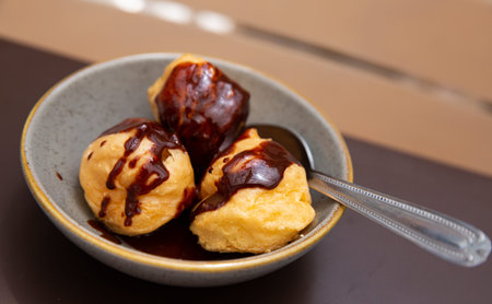 Choux pastry balls with chocolate sauce