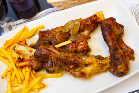 Caldereta de cordero - lamb bone with french fries