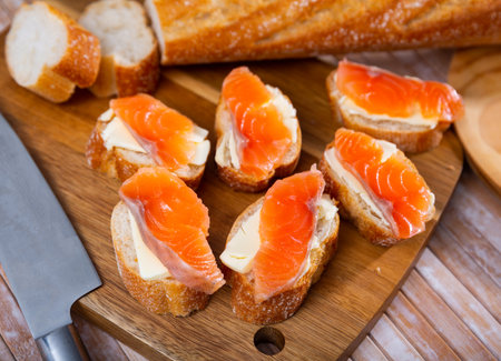 Salmon toasts with butter. Delicious lunchの写真素材