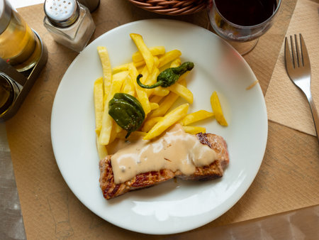 Pork steaks with fried potatoesの写真素材