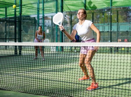 Two women tennis players playing padelの写真素材