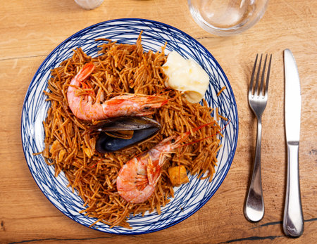 Pasta with seafood contains tiger prawns, shell mussels, spices and white sauceの写真素材