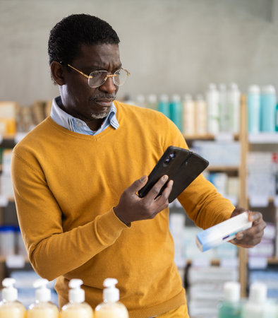 Customer scanning QR code on box of ointment in pharmacyのeditorial素材