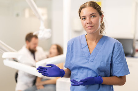 Female dentist invites you to visit dental clinic
