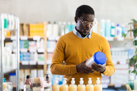 African man choose buy infant food at pharmacyのeditorial素材