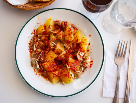 Galician dish of stewed pigs ear with pepper and potatoesの写真素材