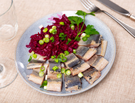 Lightly salted herring with beets served on platterの写真素材