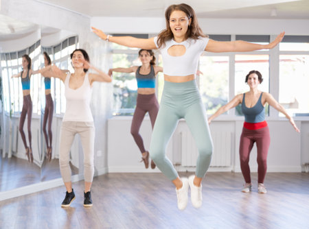 Group of women dancing modern dance in studioの写真素材