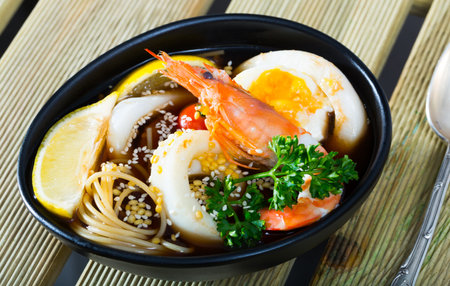 Bowl with spicy Pan-Asian soupの写真素材