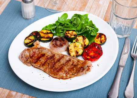 Appetizing beef entrecote with baked vegetables