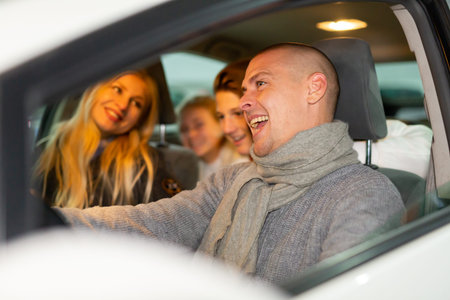 Portrait of a positive family in a car