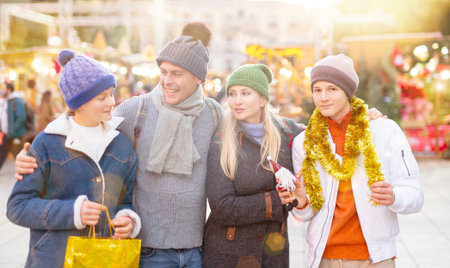 Portrait of family visiting Christmas street fairの写真素材