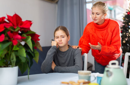 Mom soothes her teen daughter after domestic fightの写真素材