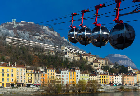 Cable car of Grenoble in sky of city in Franceの写真素材