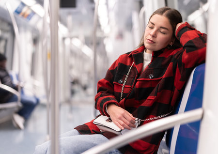 Tired woman returns to the subway