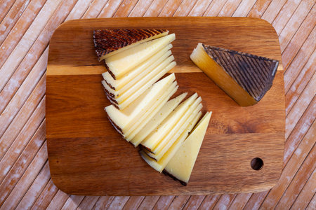 Slices of hard cheese Anejo from sheep milkの写真素材