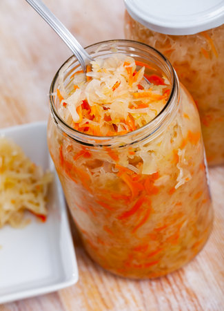 Glass jars with homemade sauerkraut. Winter foodの写真素材