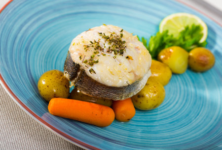 Codfish by rustically, frying and served with boiled potatoes and greens