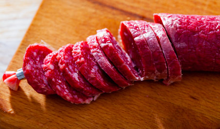 Sliced dry cured pork sausage Fuet Nobleza