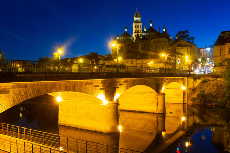 Evening view of bridge and cathedral on Isle river in Perigueuxの写真素材