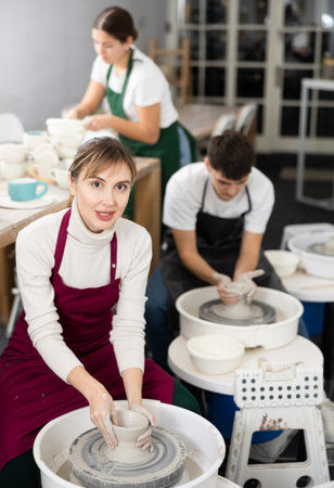 Woman working with pottery wheelの写真素材