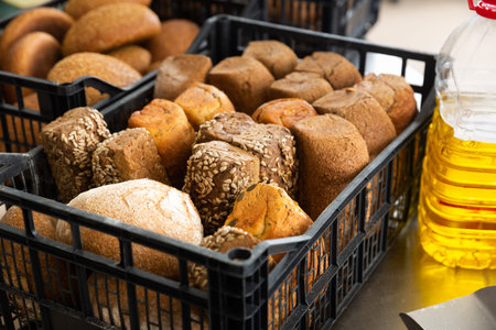 bread with seeds in baking tray in bakery