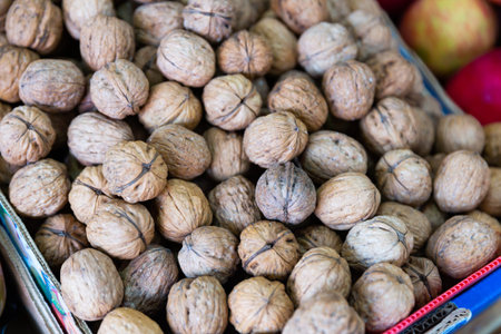 Whole walnuts in box at farmers market