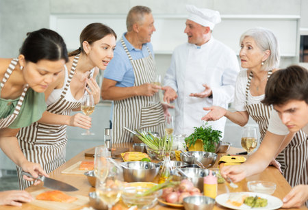 Healthy food master class. Chef apprentices learn how to cook delicious salmon filletの写真素材