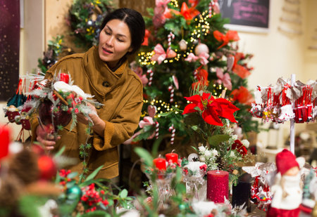 Asian female shopping Christmas decorationsの写真素材