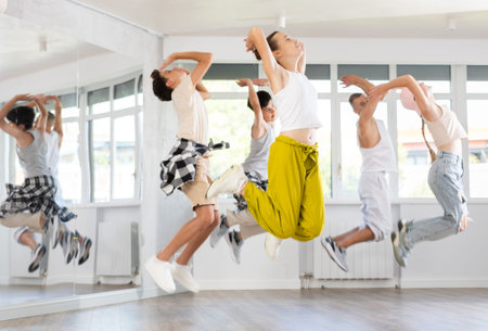 Teenage girl dancing hip hop in group
