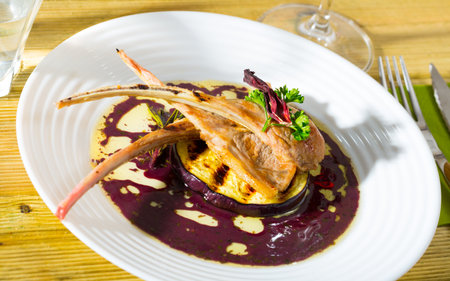 Baked lamb ribs in wine sauce with eggplant and dried hibiscusの写真素材