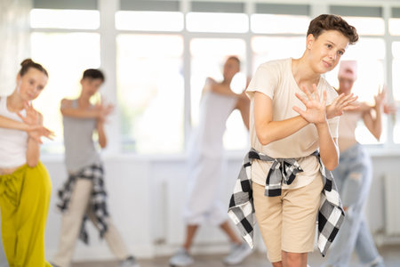 Teenage boy dancing hip hop in groupの写真素材