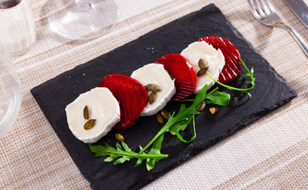 Delicious snack made of beetroot with goat cheese