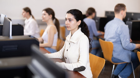 Female student at computers in university computer classの写真素材
